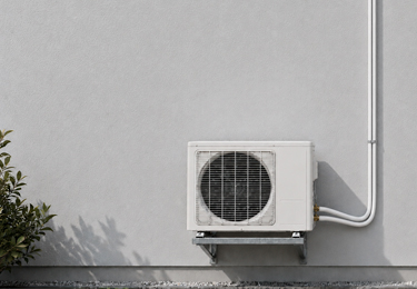 Small web news thumbnail showing an outdoor air conditioning unit with insulated lines on a wall.