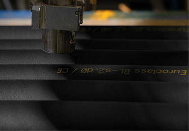 Small web news crop showing black K-FLEX insulation material with printed technical markings.