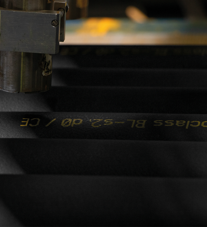 Tall web news crop showing black K-FLEX insulation material with printed technical markings.