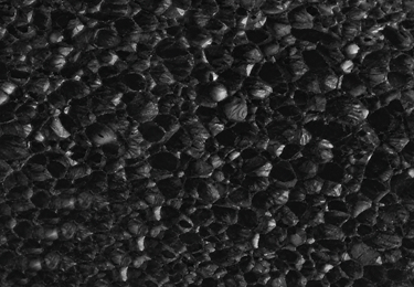 Macro view of a closed-cell material structure with small cavities.