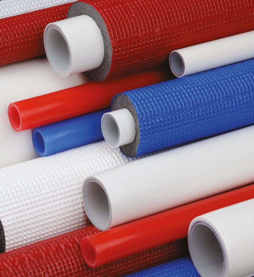 Vertical crop of red, white and blue K-FLEX insulated and uninsulated multilayer pipes.