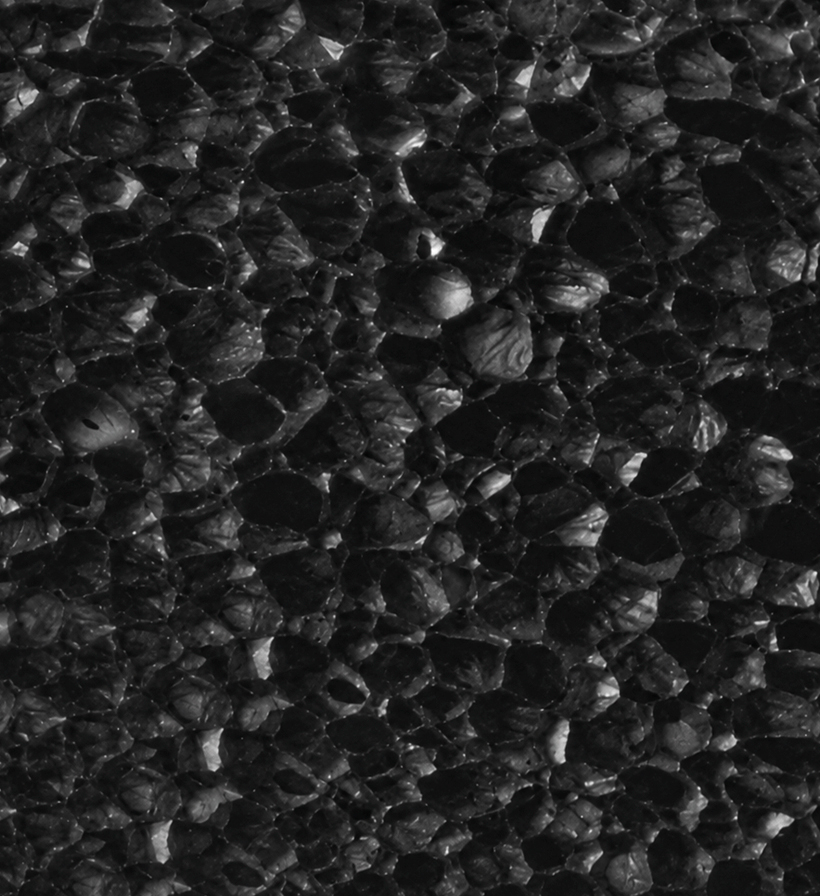 Macro view of a closed-cell material structure with small cavities.